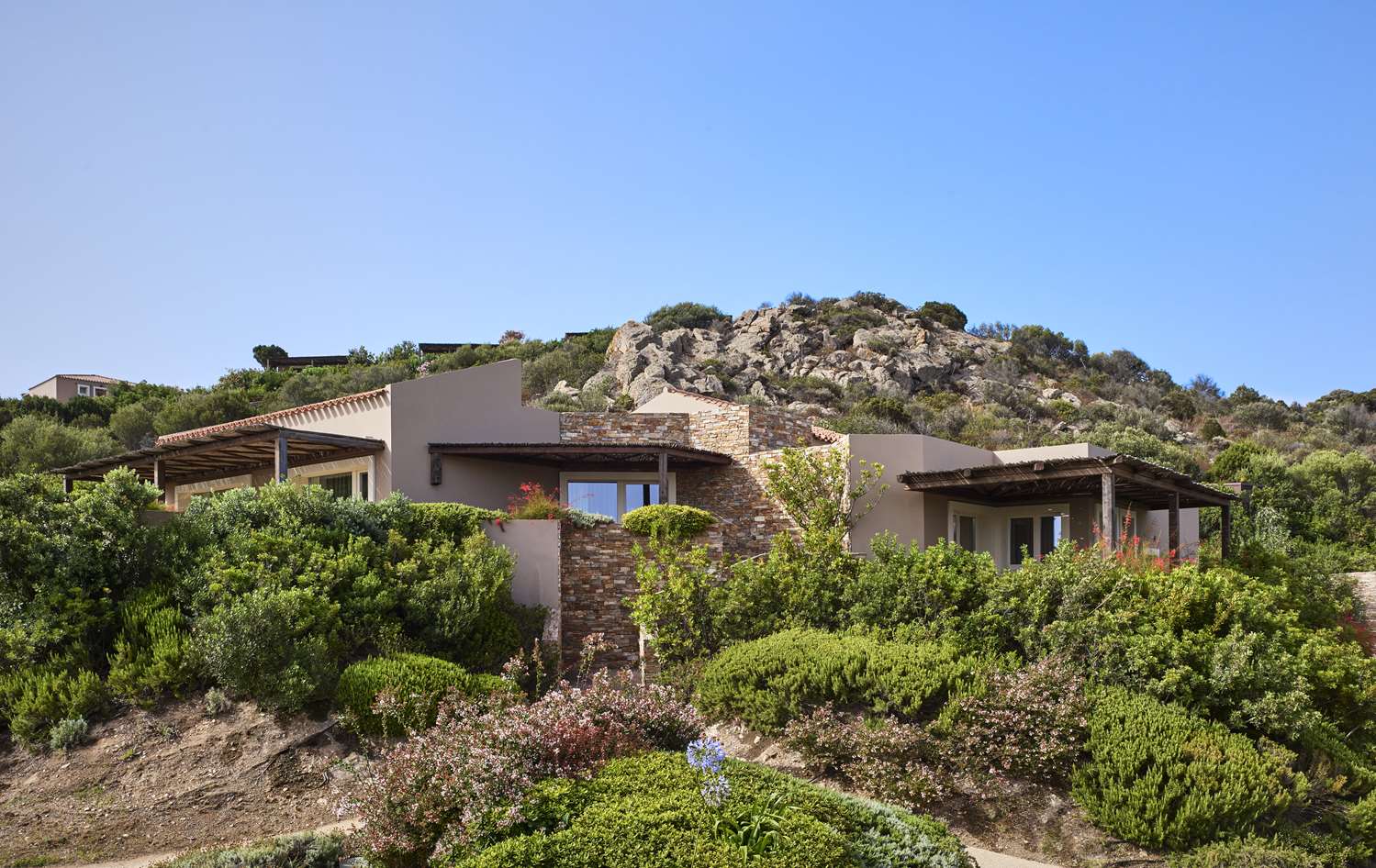 Baia Chia Laguna Resort, Curio Collection by Hilton